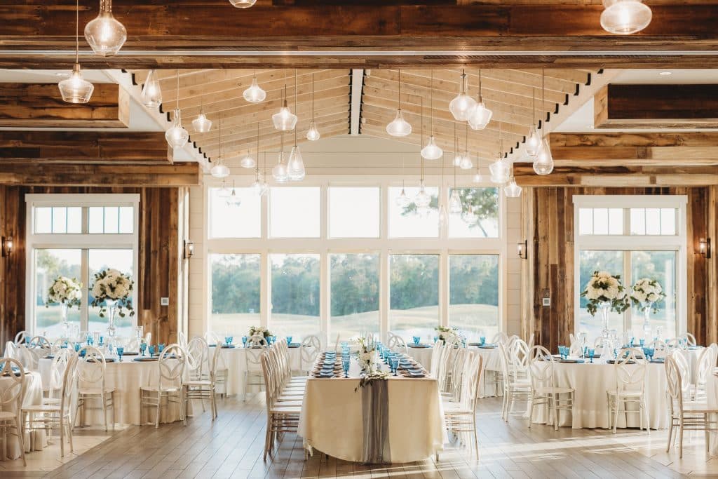 ballroom set for wedding reception in golds and creams at St. Johns Golf & Country Club