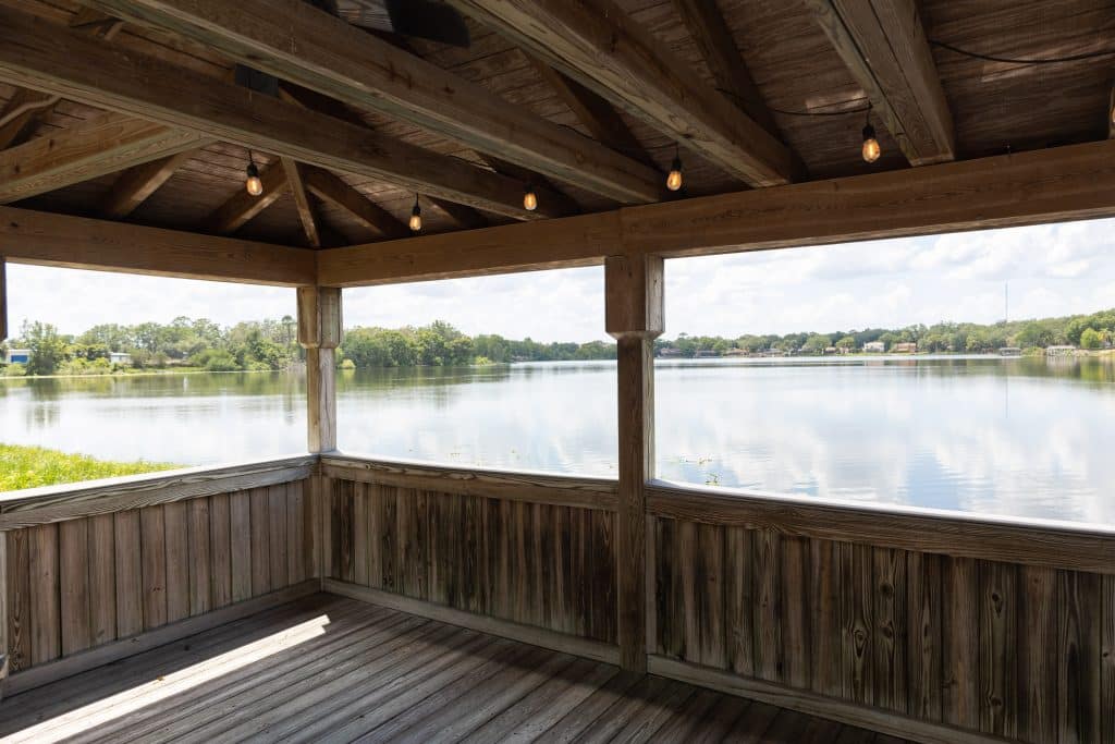 covered wooden dock overlooking lake at enzo's on the lake in orlando florida