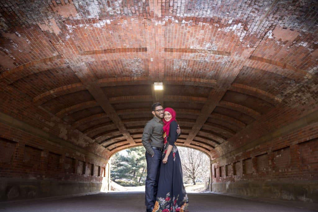 couple standing in tunnel by Evan Hampton Photography