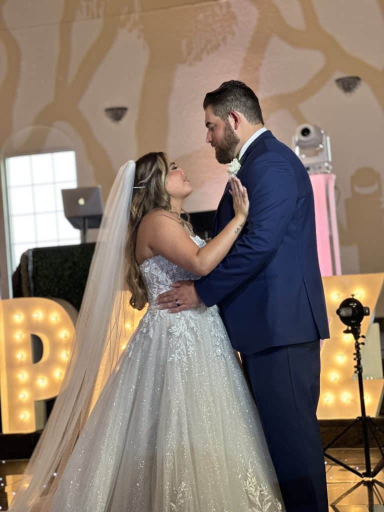 bride and groom share first dance at wedding by Elite Celebrations