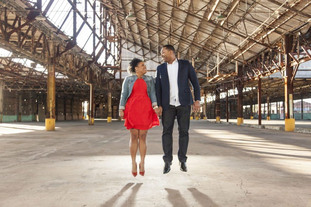 couple jumping in industrial building by Evan Hampton Photography