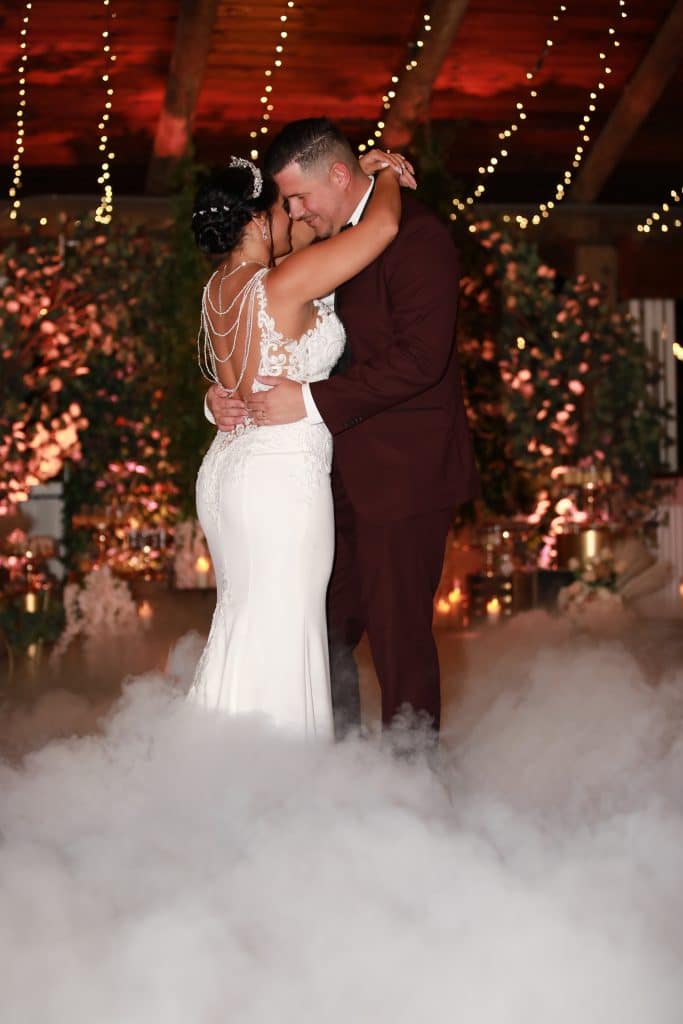 bride and groom dancing on a cloud at a wedding by Elite Celebrations