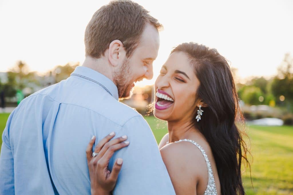 man and woman laughing photographed by Hundreds of Moments Photography
