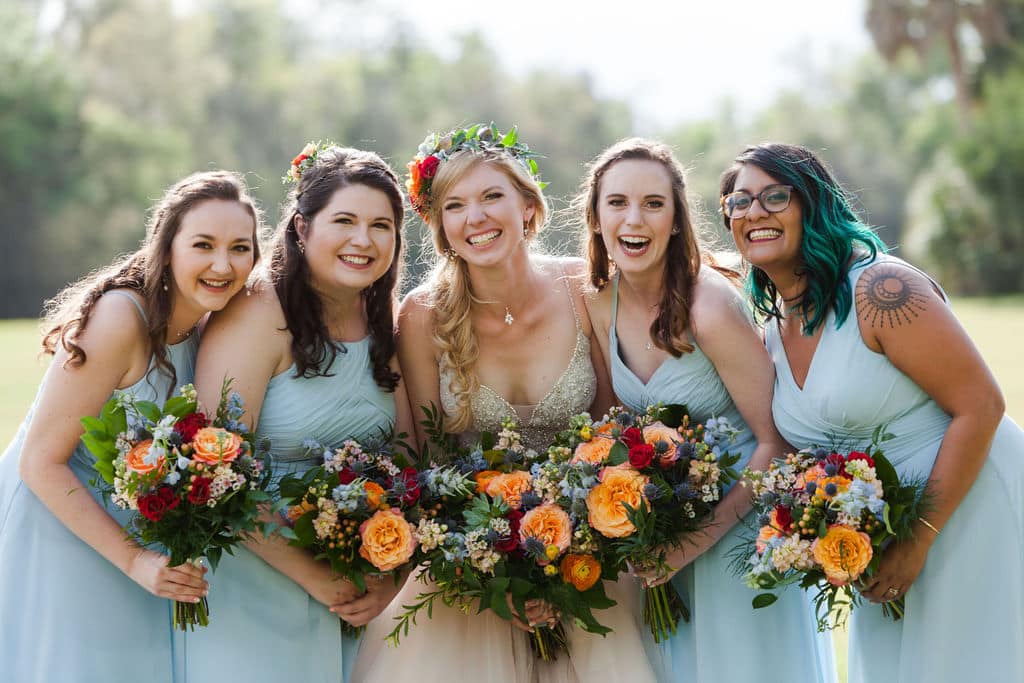 bridal party with wild flower bouquet photographed by Hundreds of Moments Photography