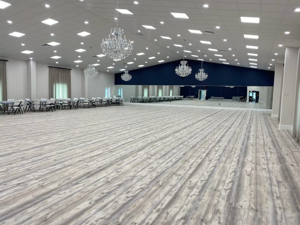 Spacious ballroom with wall to ceiling windows, chandeliers and new flooring, Central, FL