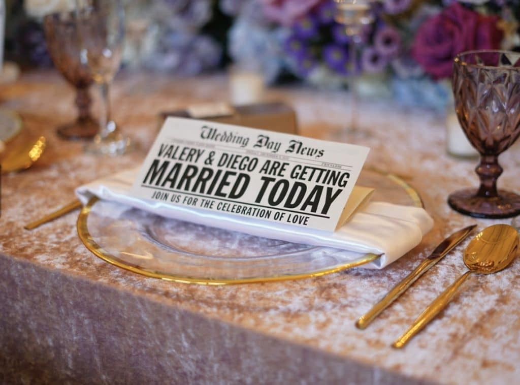 wedding headline at each table setting by Elite Celebrations