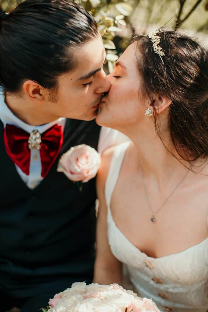 Close up embrace of a couple with a gentle kiss on their wedding day in Orlando, FL