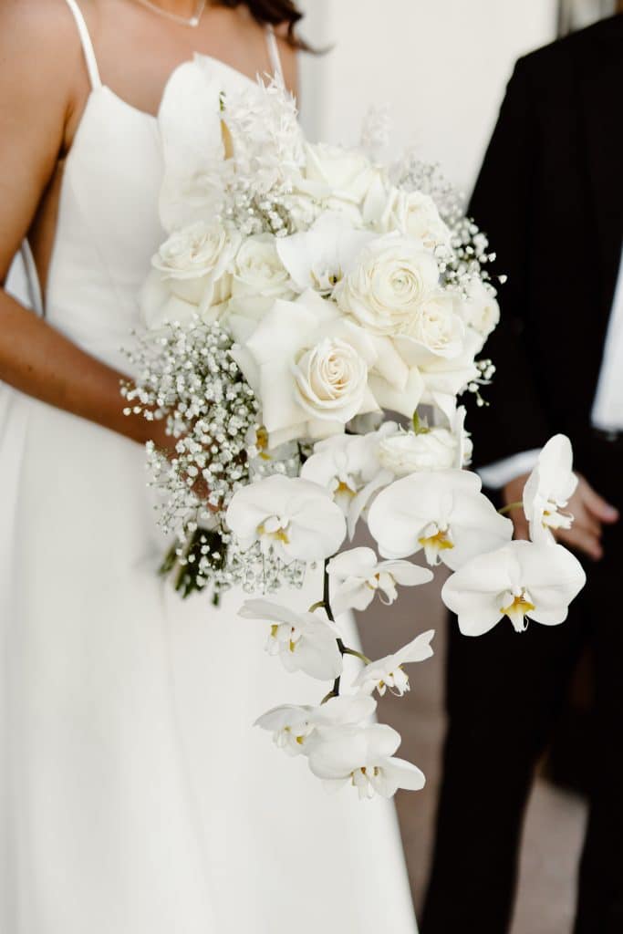 elegant white rose and babies breath bouquet from In Bloom Florist