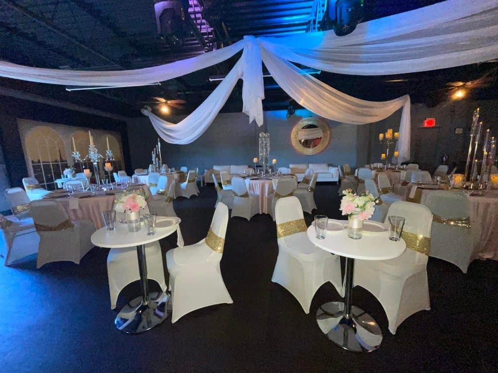ballroom event space black floors and white hanging fabric rom the ceiling at the Encima Orlando Event center wedding venue located in Orlando, Florida