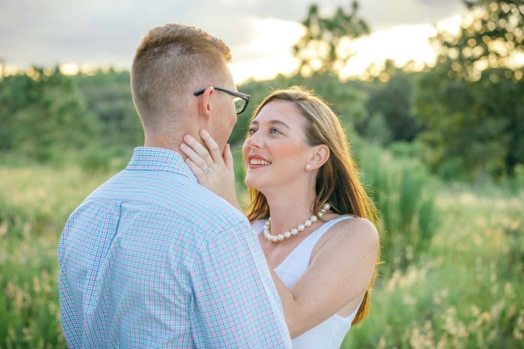 engaged couple smiling at each other photographed by Slone Photography, LLC