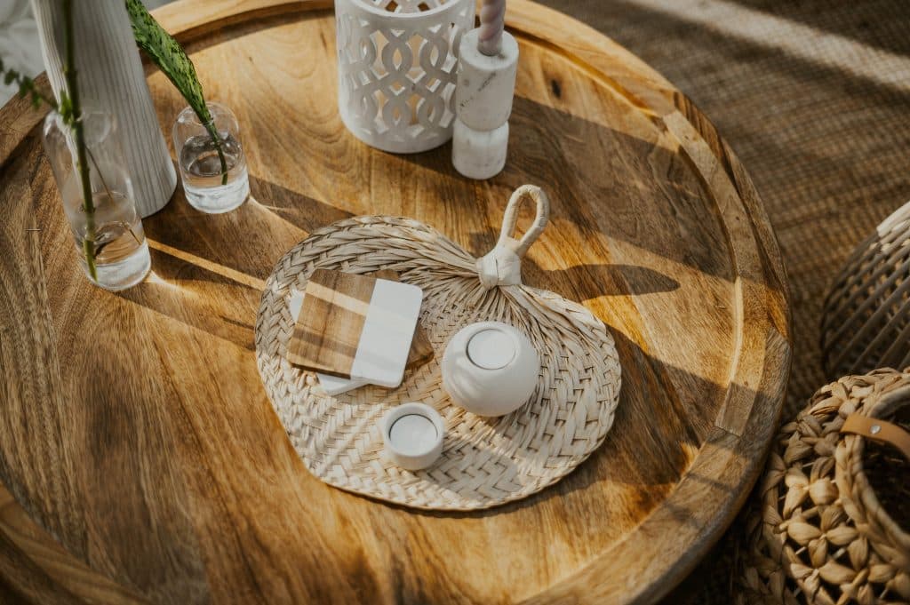 rattan table settings on wooden tabletop from Echo Event Rentals