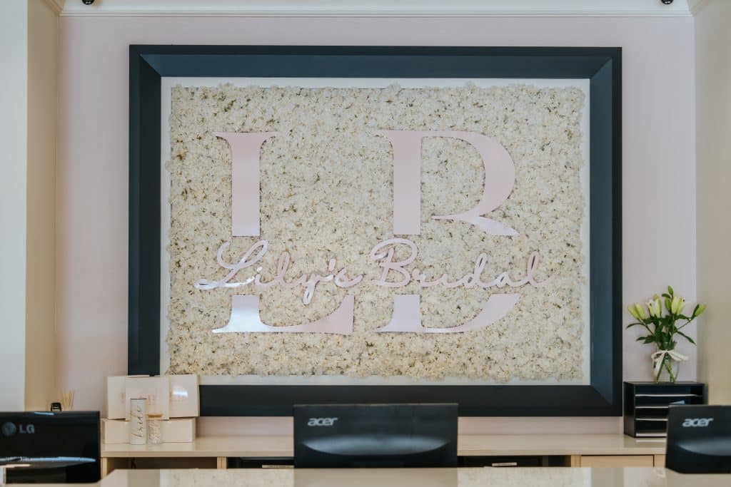 large lithograph of Lily’s Bridal logo framed