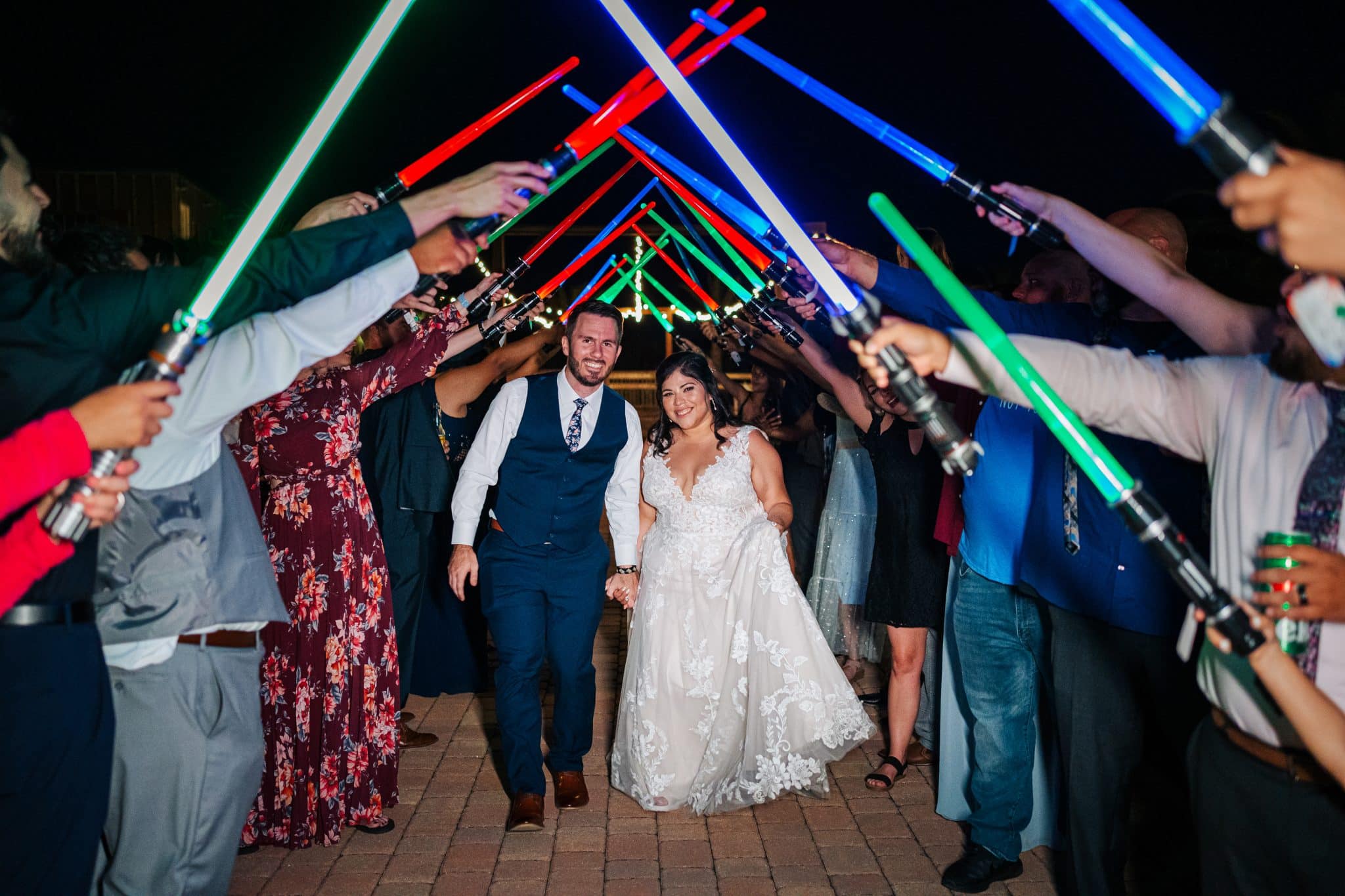 Light saber exit for a whimsical wedding at Hidden Barn Venue in Central Florida