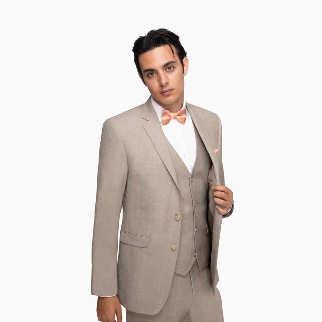 Man in tan three piece suit, with a coral accent, Generation Tux