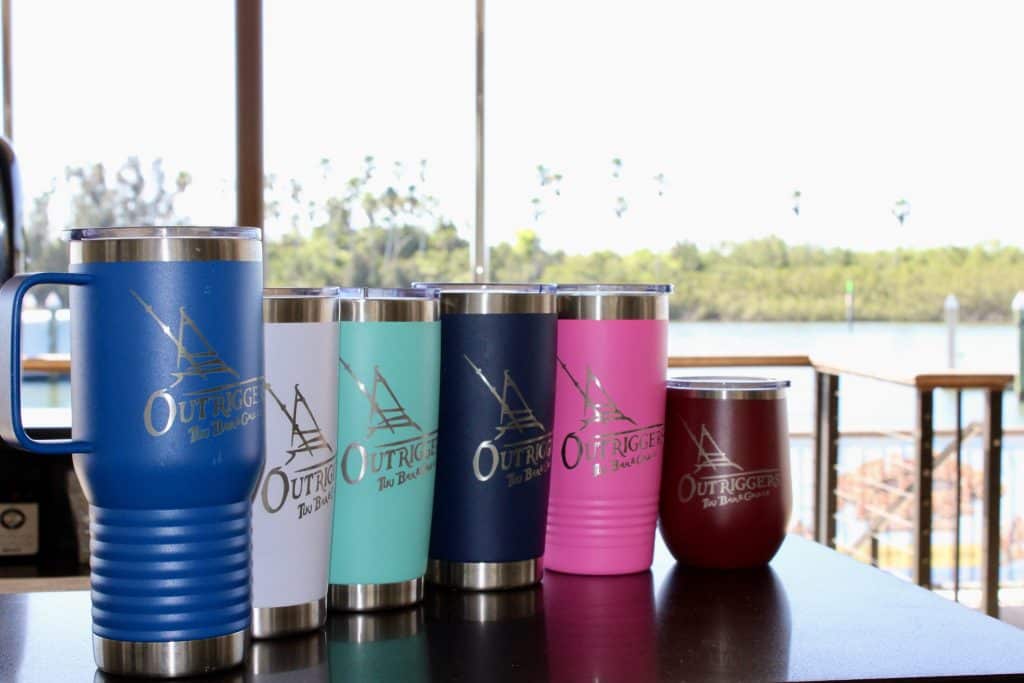a variety of travel mugs and wine travel mugs with the Outriggers Tiki Bar & Grille logo on them, Central FL