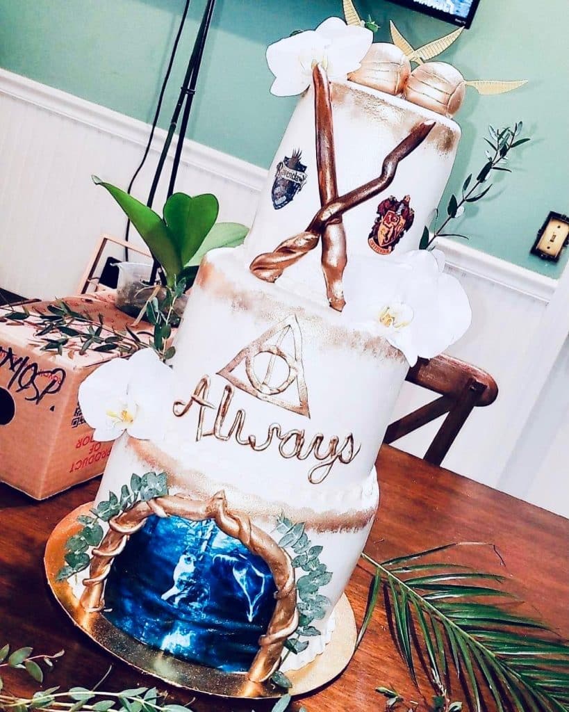 Harry Potter themed cake with family signs and wands on the top tier, Central FL