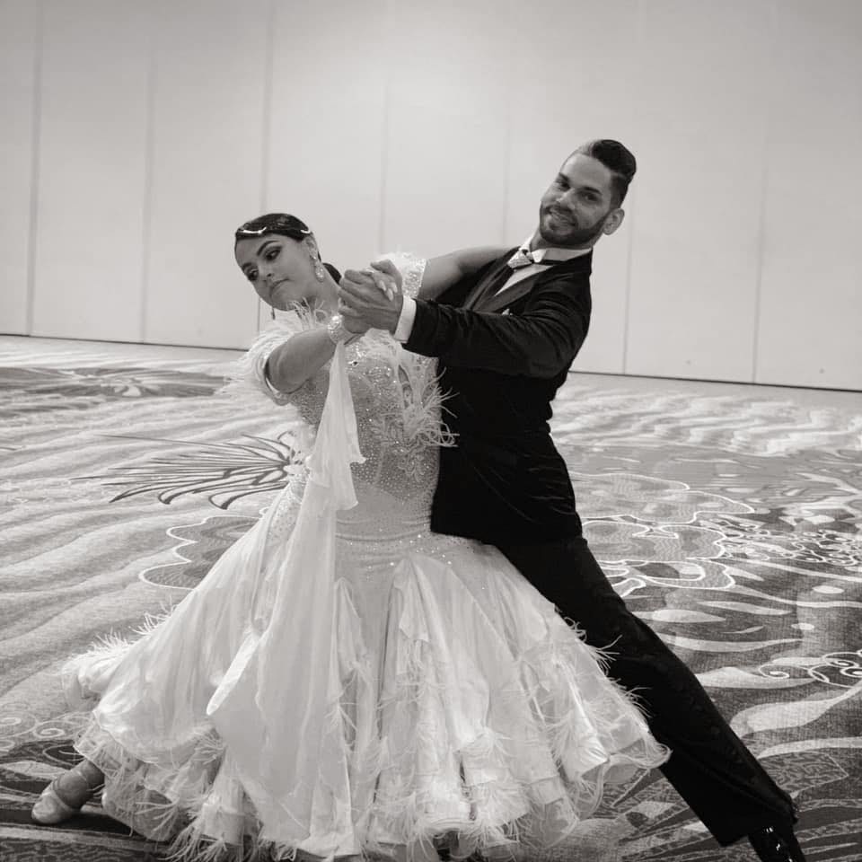 Black and white photo of a couple dancing in a ballroom, Dance It Studio