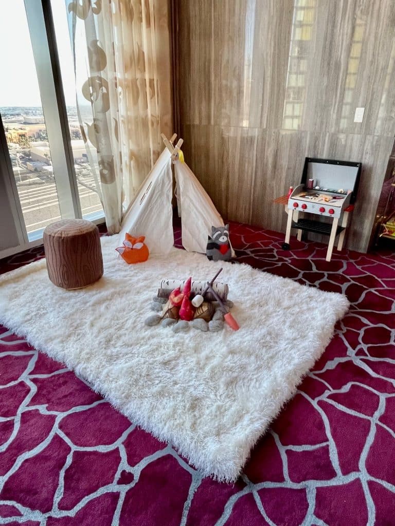 Camping time indoors with a pretend grill and pretend fireplace, a teepee and white soft rug, Central FL