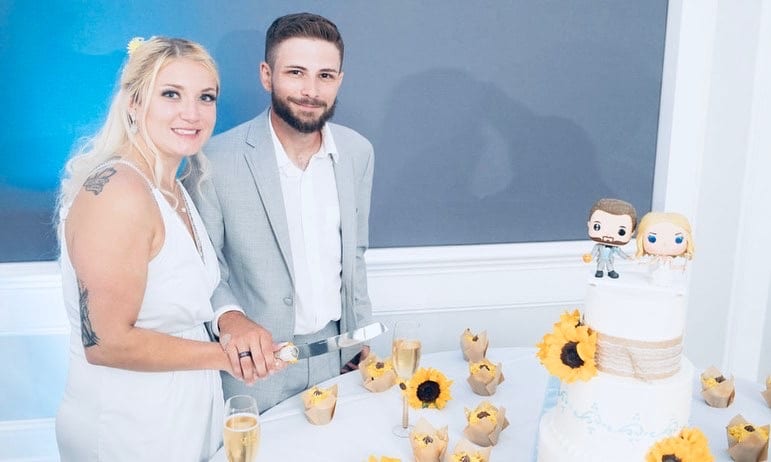 Bride and Groom cutting their cake and cupcakes that are sunflower themed, Bells Cake House, Central FL