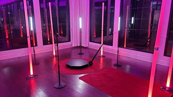 Uplighting of pink with red carpets, large floor length windows set up for a special event, Kwik Entertainment