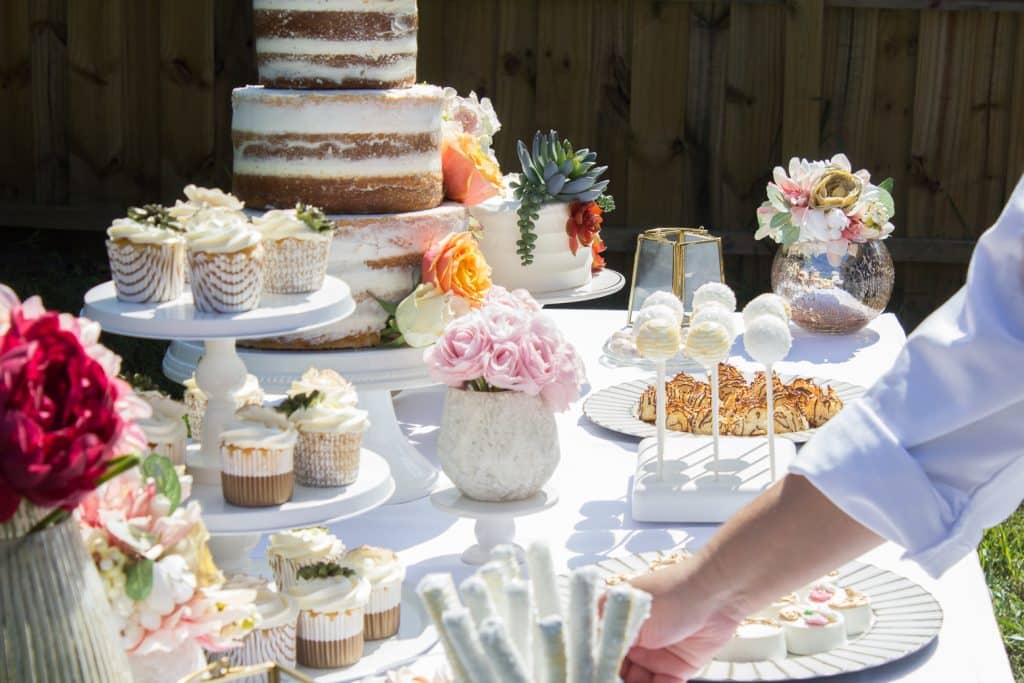 Dessert table that includes cakes, cupcakes, cake pops and white chocolate covered cookies, Special Treats by Tanya, Orlando, FL