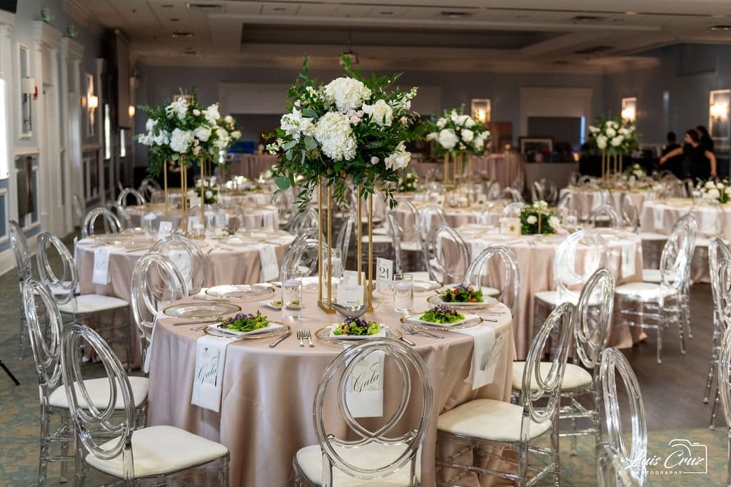 Reception Set Up with champagne tablecloths, tall white flower centerpieces, silver and white chairs, JF Events and Flowers