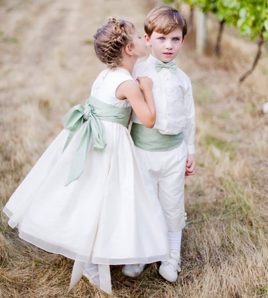 Flower girl and Ring Bearer outdoors in their wedding attire, white with mint green accessories, Central FL