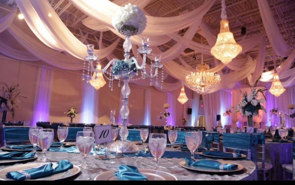Different view of the reception with the teal theme and purple uplights, Central FL