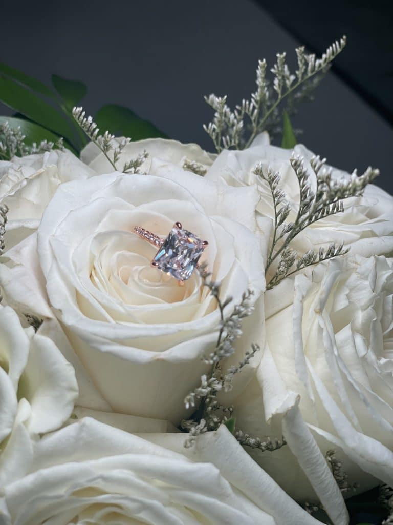 Close up shot of white roses adorned with baby's breath, JF Events and Flowers