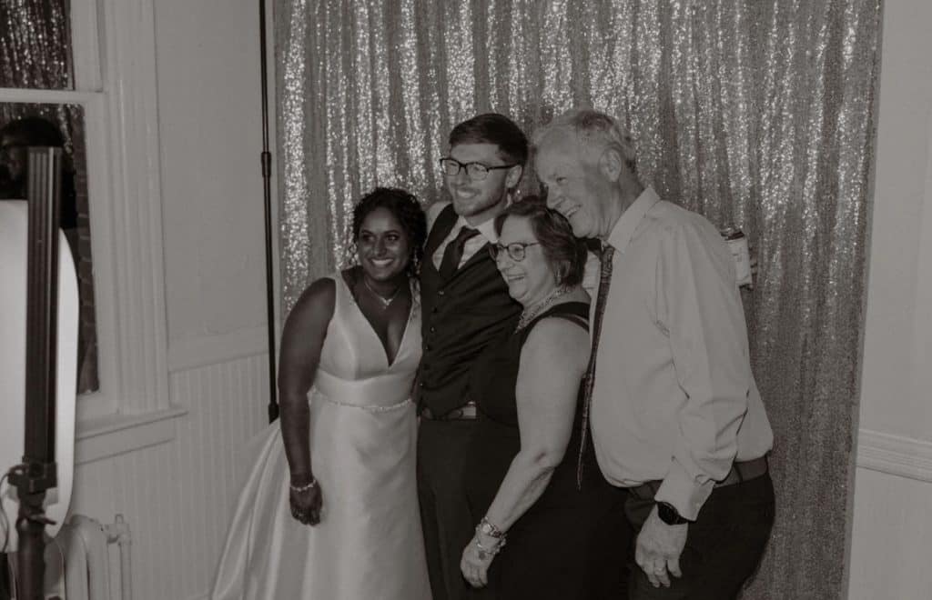 Black and white photo booth shot of the wedding couple with guests, Central, FL