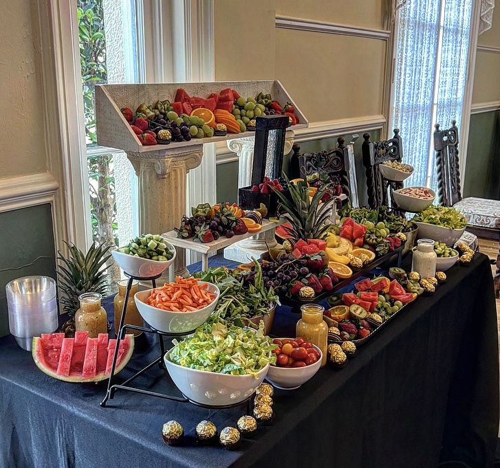 Fresh Fruit display on three levels, side view, on a black tablecloth, Queen Chef Catering, Central FL