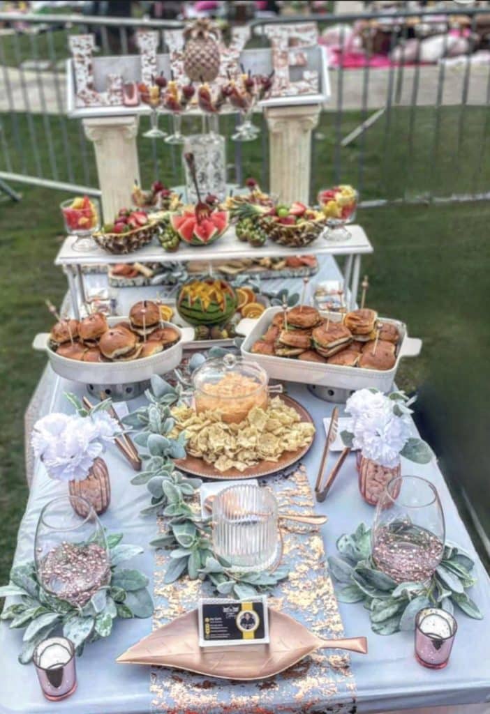 Finger sandwiches and small bites for a special event, multiple displays on a table outdoors, Queen Chef Catering, Central FL