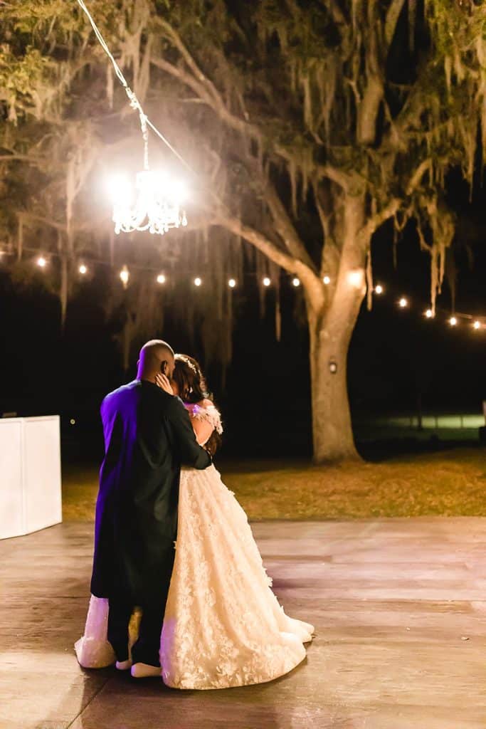 Wedding couple looking into the night sky, twinkling lights, Orlando, FL