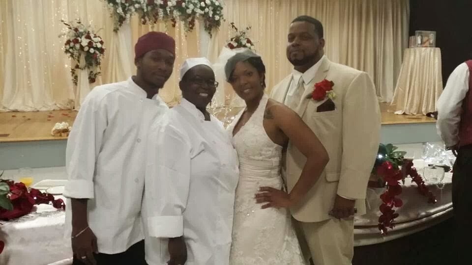 Chef Teri with the bride, groom and a member of the catering staff at a wedding reception, Central FL