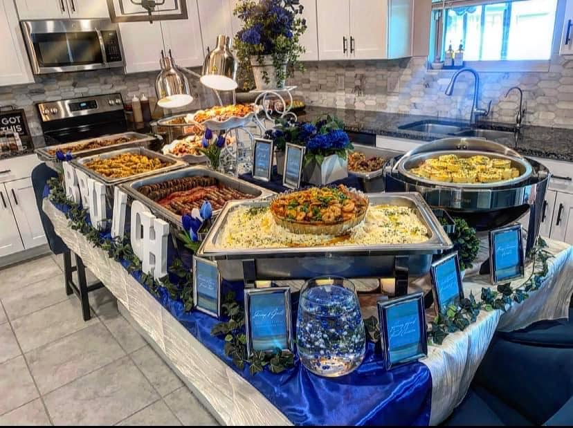 Brunch display on a white tablecloth with blue runner, all in chaffing dishes, Central Fl