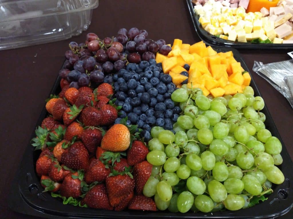 Fruit platter on a table, with a cheese platter in the background, Teri & Co Catering Services, Central FL
