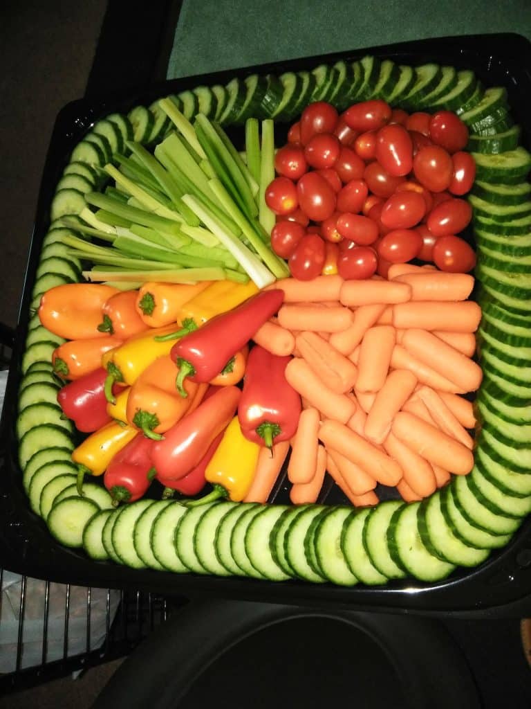 Vegetable platter of carrots, peppers, tomatoes, celery, surrounded by cucumbers, Central FL