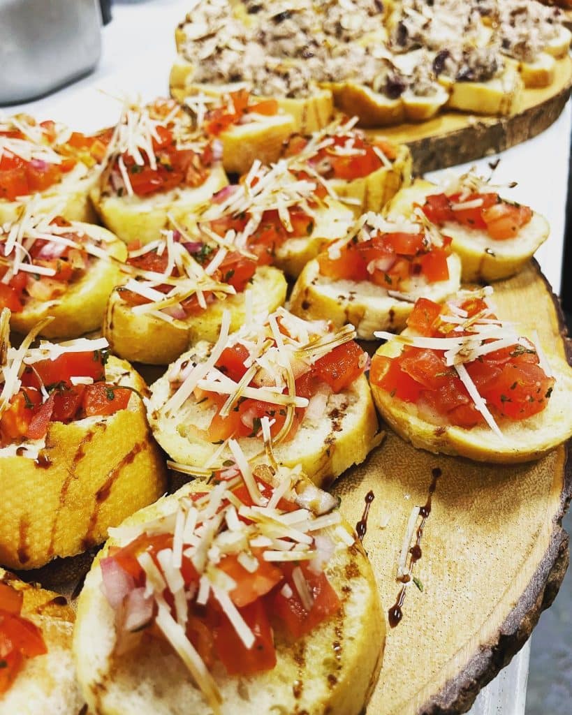 Crostini with tomatoes, cheese and balsamic drizzle, Creations Cuisine Inc, Central FL