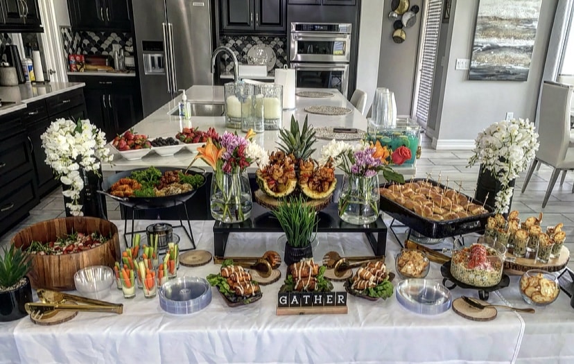 Party set up in a kitchen for a party, buffet display of a salad, sandwiches and finger foods, Central FL