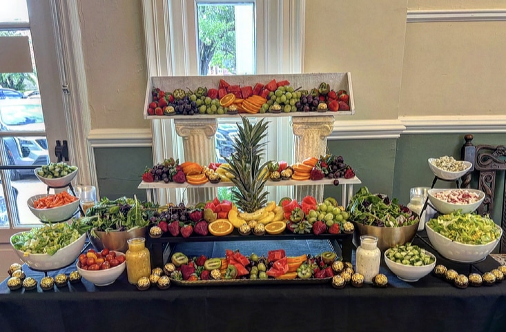 Fresh Fruit display on three levels, front view, on a black tablecloth, Queen Chef Catering, Central FL