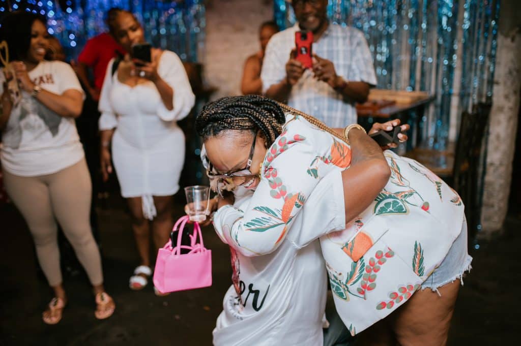 couple hugs after getting engaged in escape room marriage proposal
