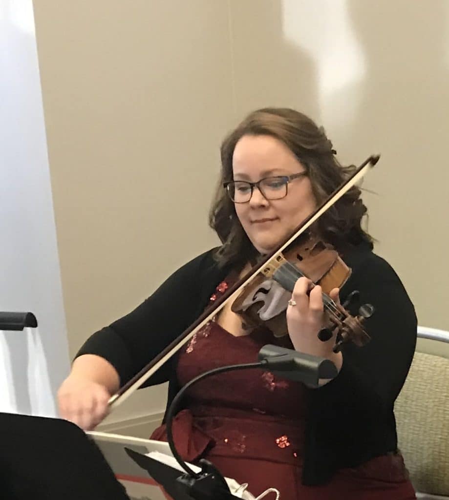 Rachel Durrum Music LLC, playing a violin at an event with a music stand and light on the stand, Orlando, FL