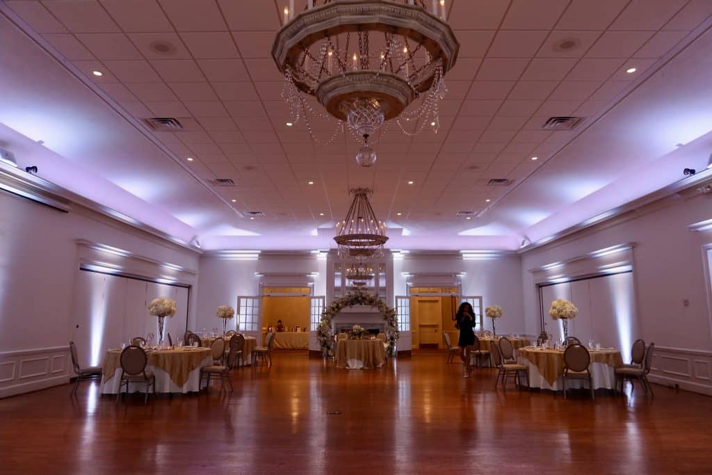 Wide shot of a ballroom space, set with a few small tables, Orlando, FL