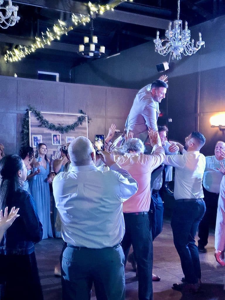 guests have lifted the groom up in the crowd, Diamond Dj Events, Orlando, FL