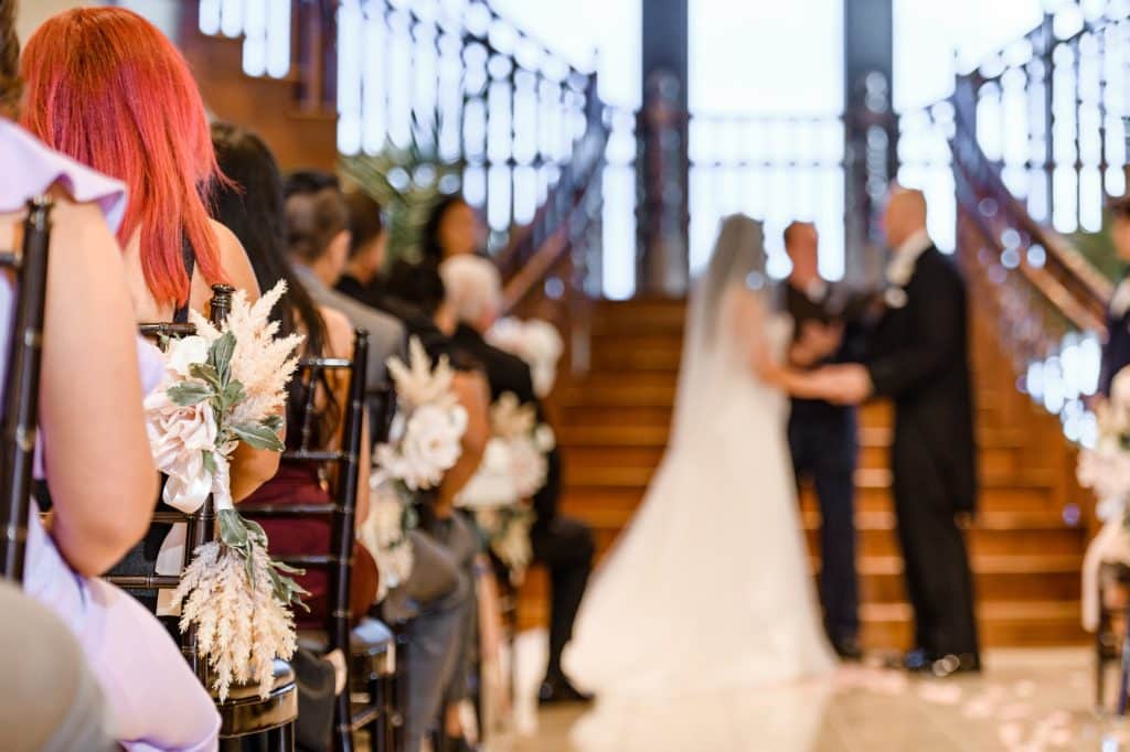 bride and groom stand together in ceremony
