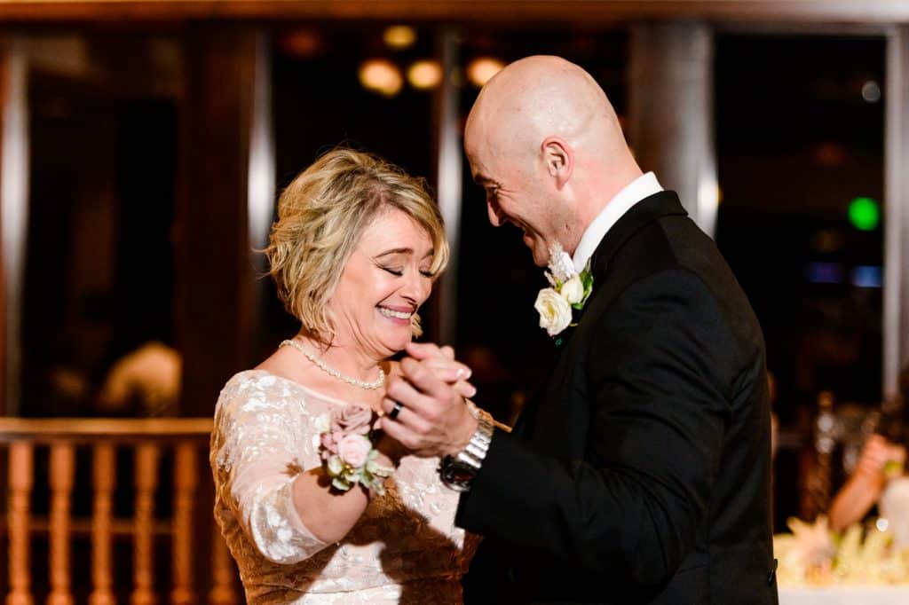 groom dances with his mother on wedding day