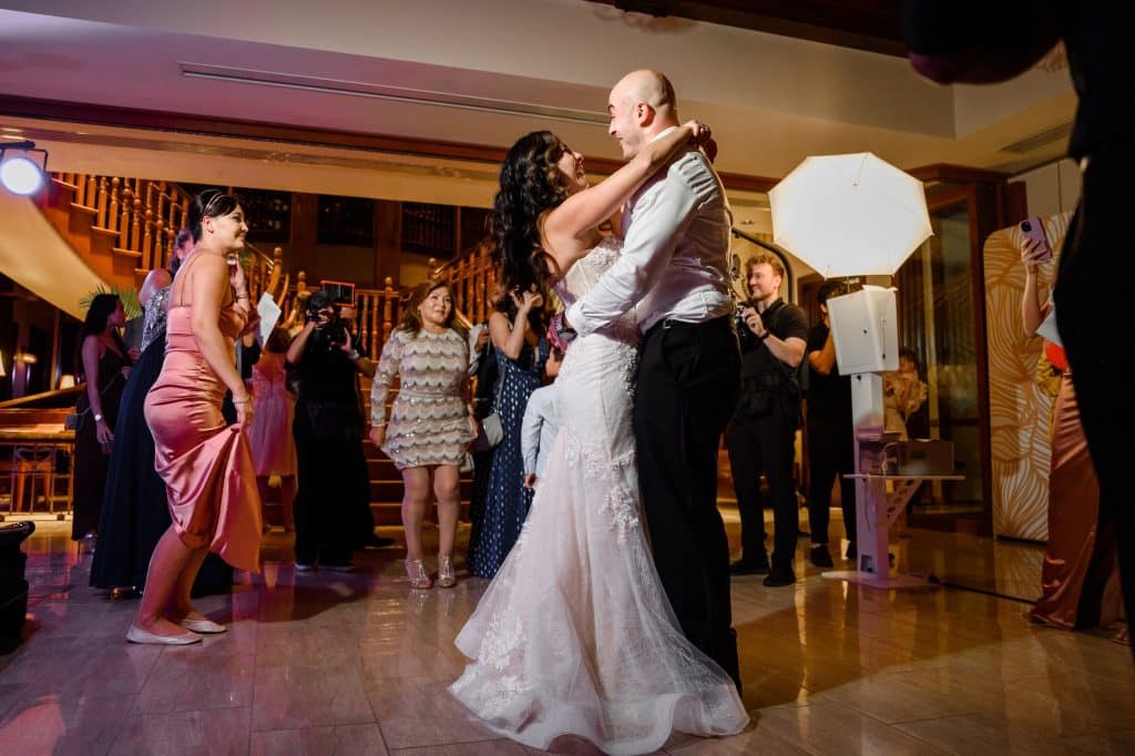 bride and groom dance together during wedding reception