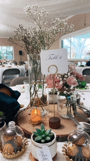 tablescape, table sign, succulents, flowers, candles on the center board bubble vase with pink flowers, tall case with white baby' breath, Orlando, FL