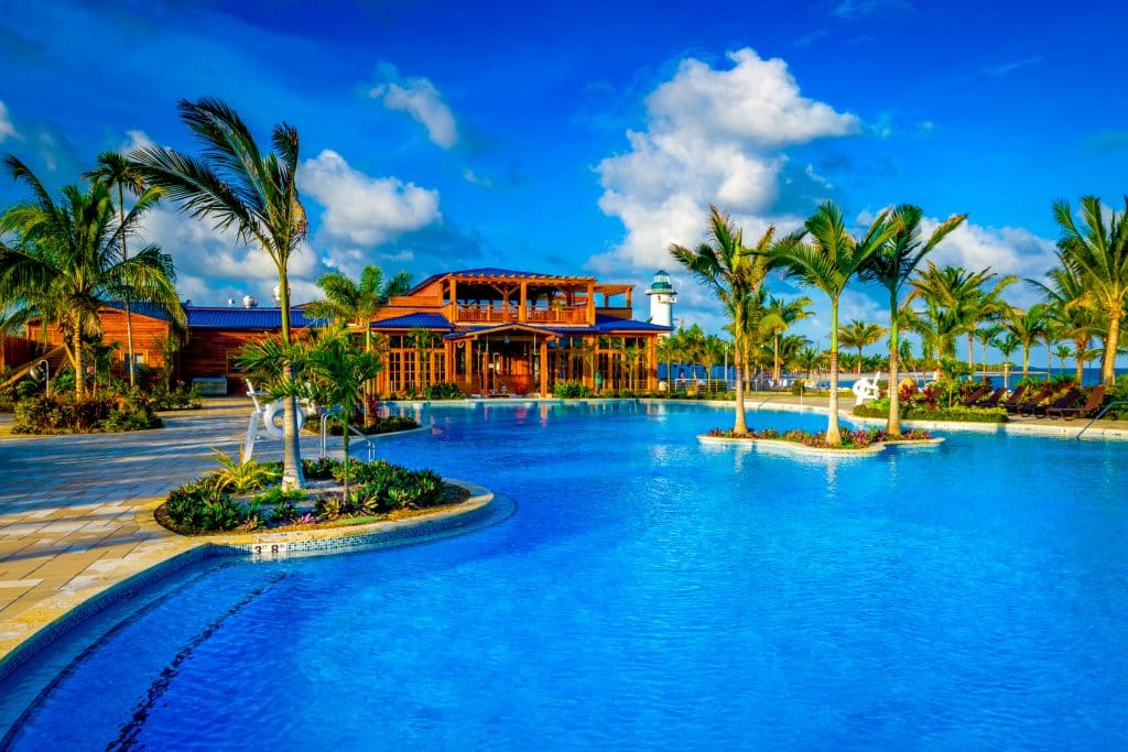 resort, clear blue water, palm trees, cruise island travel, orlando, fl