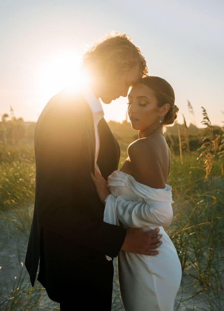 close up of wedding couple in a field as the sun sets, APG Beauty, Central FL